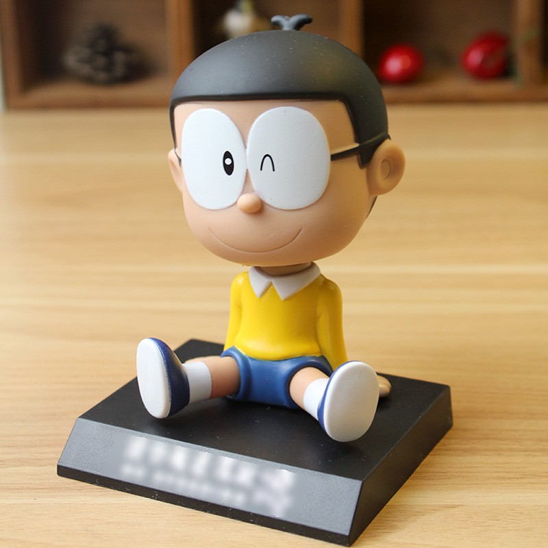 Kệ để điện thoại mô hình Nobita gật gù