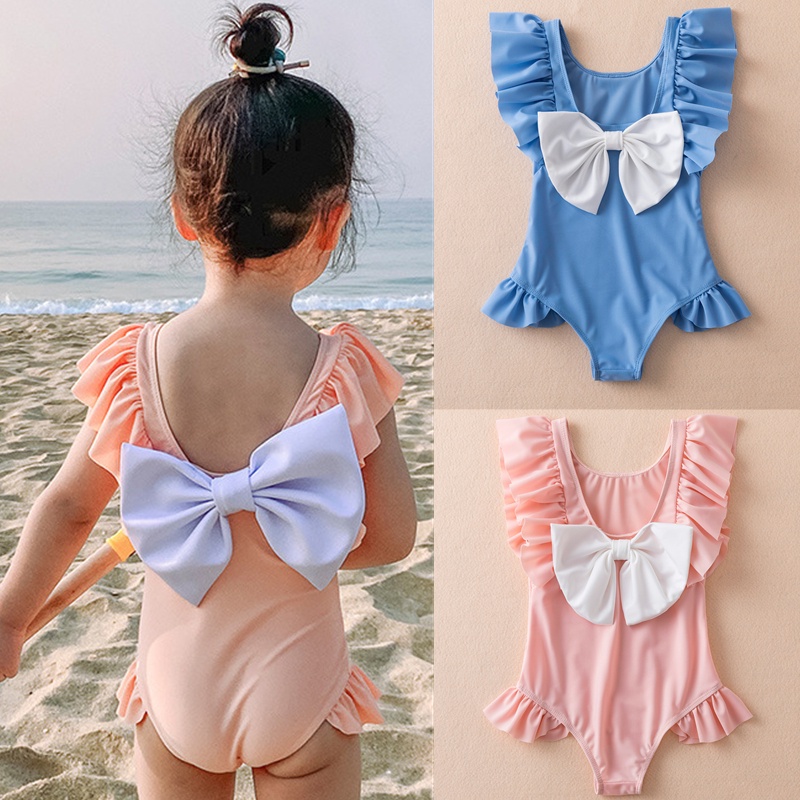 Đồ bơi liền một mảnh hở lưng đính nơ xinh xắn dành cho bé gái xấp xỉ 1-5 tuổi