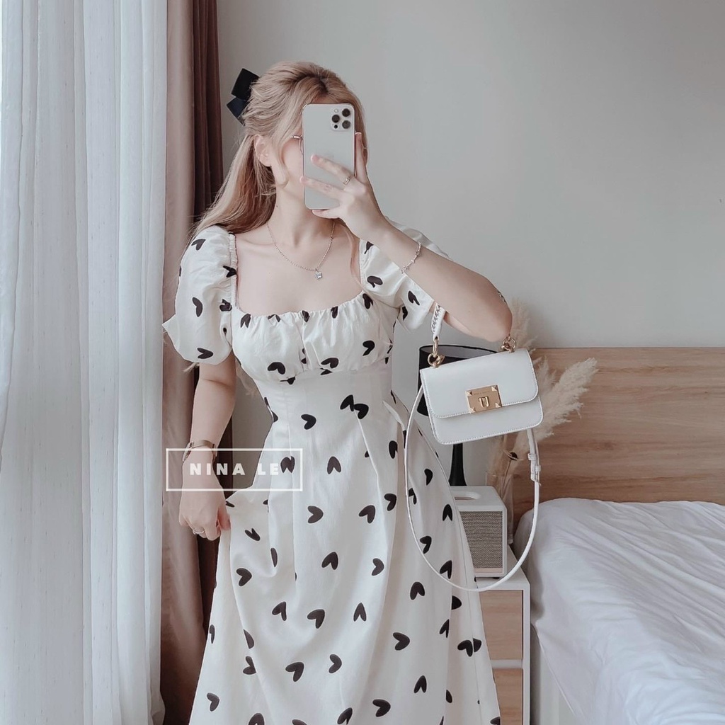 Đầm xòe cổ vuông tay phồng nơ lưng họa tiết trái tim