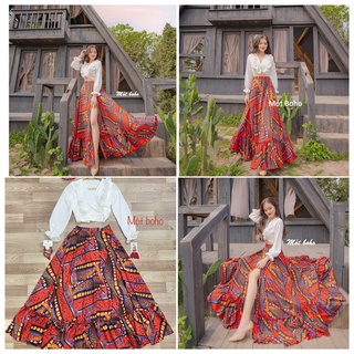 Sét áo voan trắng 2 đường viền bèo ngực và chân váy voan thổ cẩm nâu cam pha hoạ tiết vàng, xẻ chân