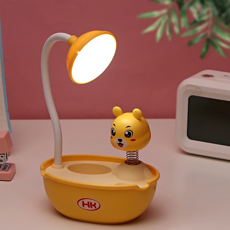 Đèn học chống cận để bàn có pin tích điện đèn led lò xo hình thú có ống cắm bút