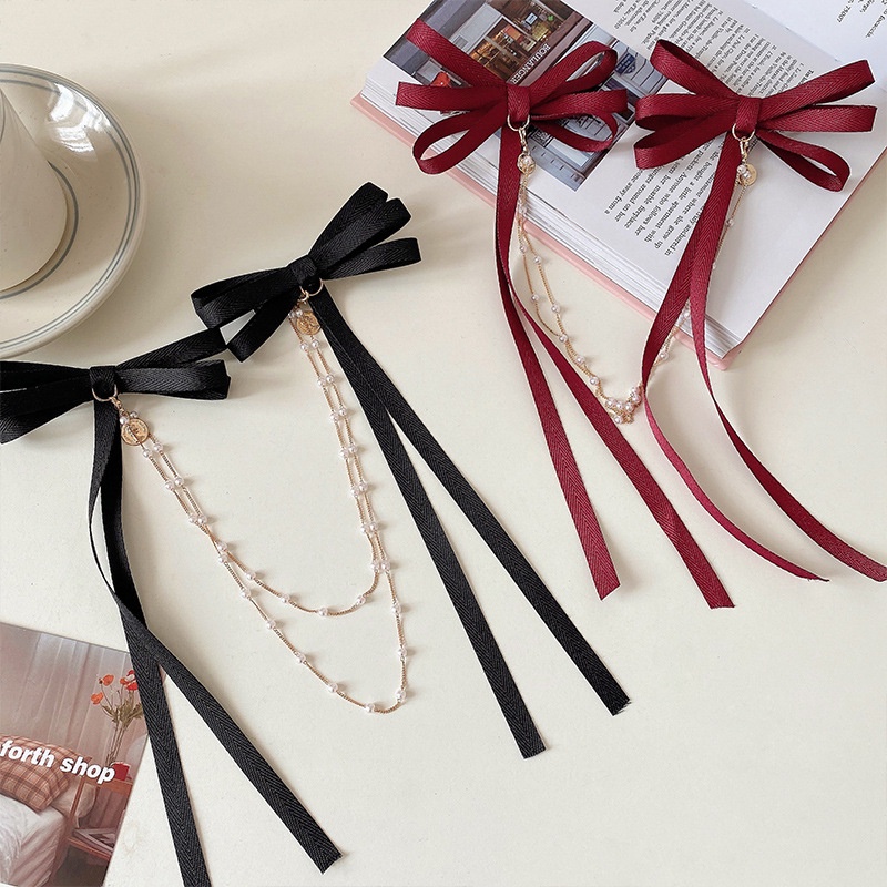 Kẹp tóc ruy băng màu đen thắt nơ phối tua rua thời trang dành cho nữ