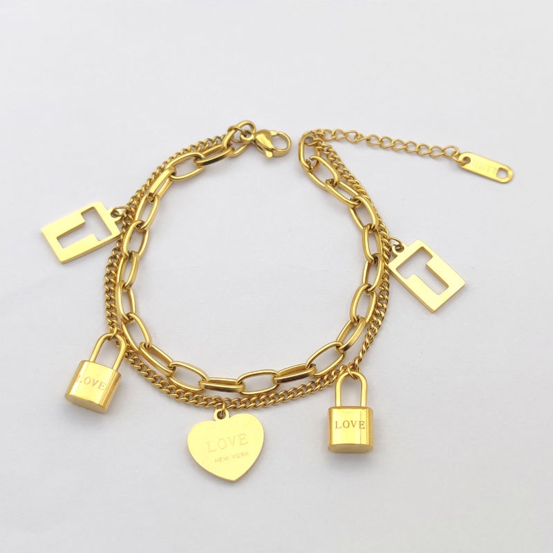 Lắc tay chữ T ổ khóa trái tim thép titan vàng không rỉ