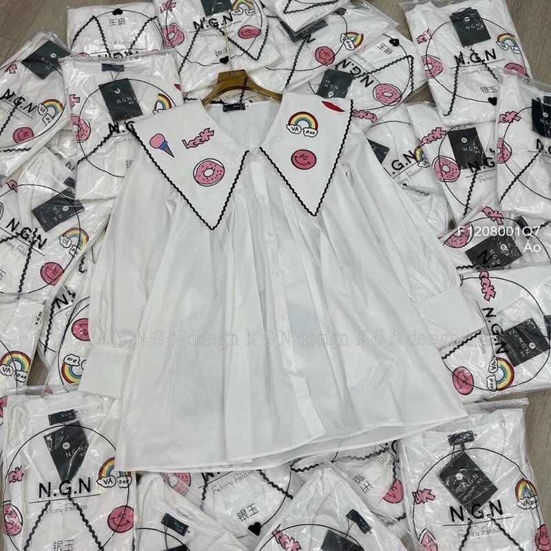 Áo sơ mi Baby cổ nhọn viền thêu phối hình bánh form rộng CƯNG TT1208