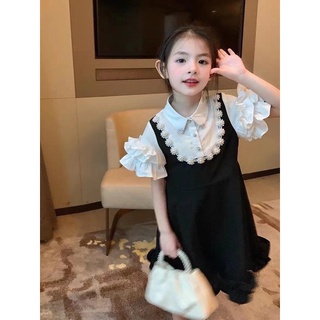 Váy đen phối ngọc bé gái