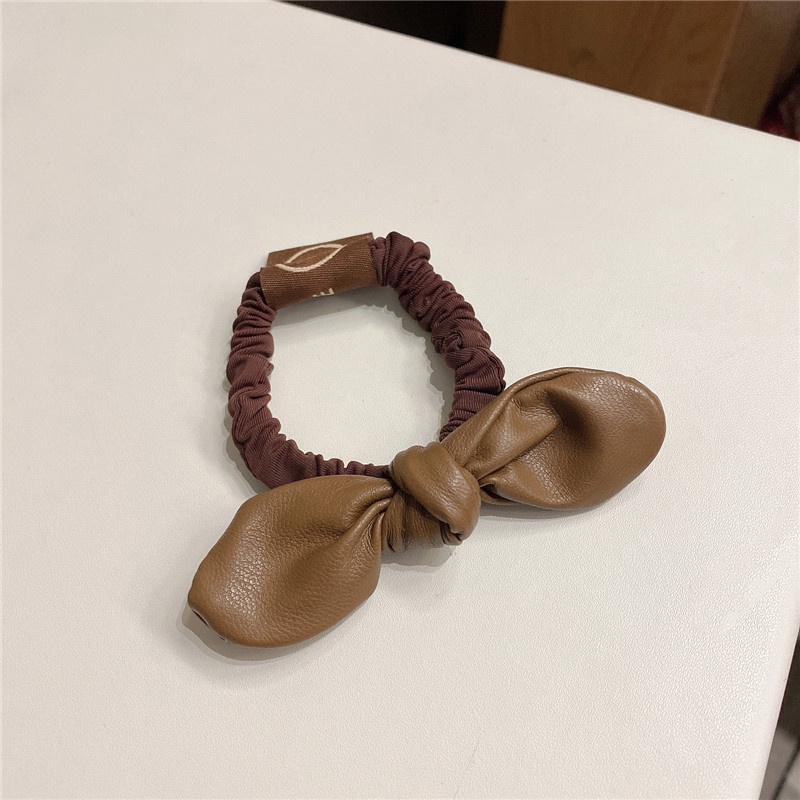 Băng đô da đính nơ đơn giản cho nữ