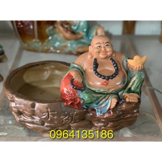 Tượng phật di lặc bên chậu cây gốm sứ Bát Tràng