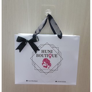 100 Túi size L đính nơ in theo yêu cầu ( giấy couche dẻo)