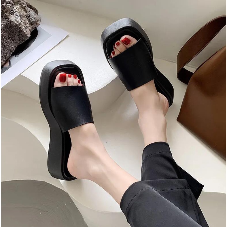 Black wedge platform flip-flops