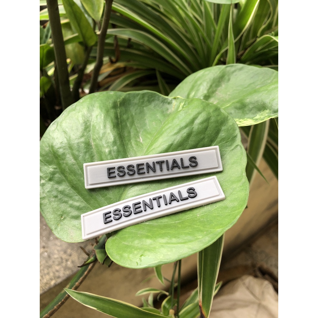 Nhận sản xuất tem mác cao su ESSENTIALS thương hiệu theo yêu cầu giá rẻ.