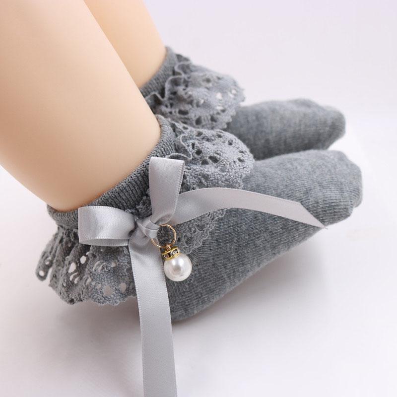 Đôi vớ cotton màu trơn trang trí nơ đính ngọc trai xinh xắn dành cho bé gái