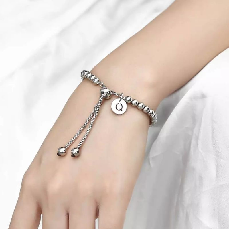 Lắc tay bi inox kiểu dây rút gắn charm tròn (có khắc theo yêu cầu)