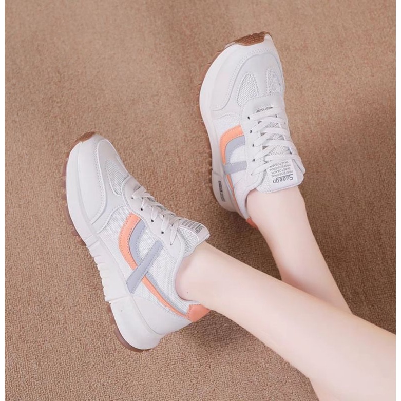 Giầy thể thao nữ phối viền cam và xanh