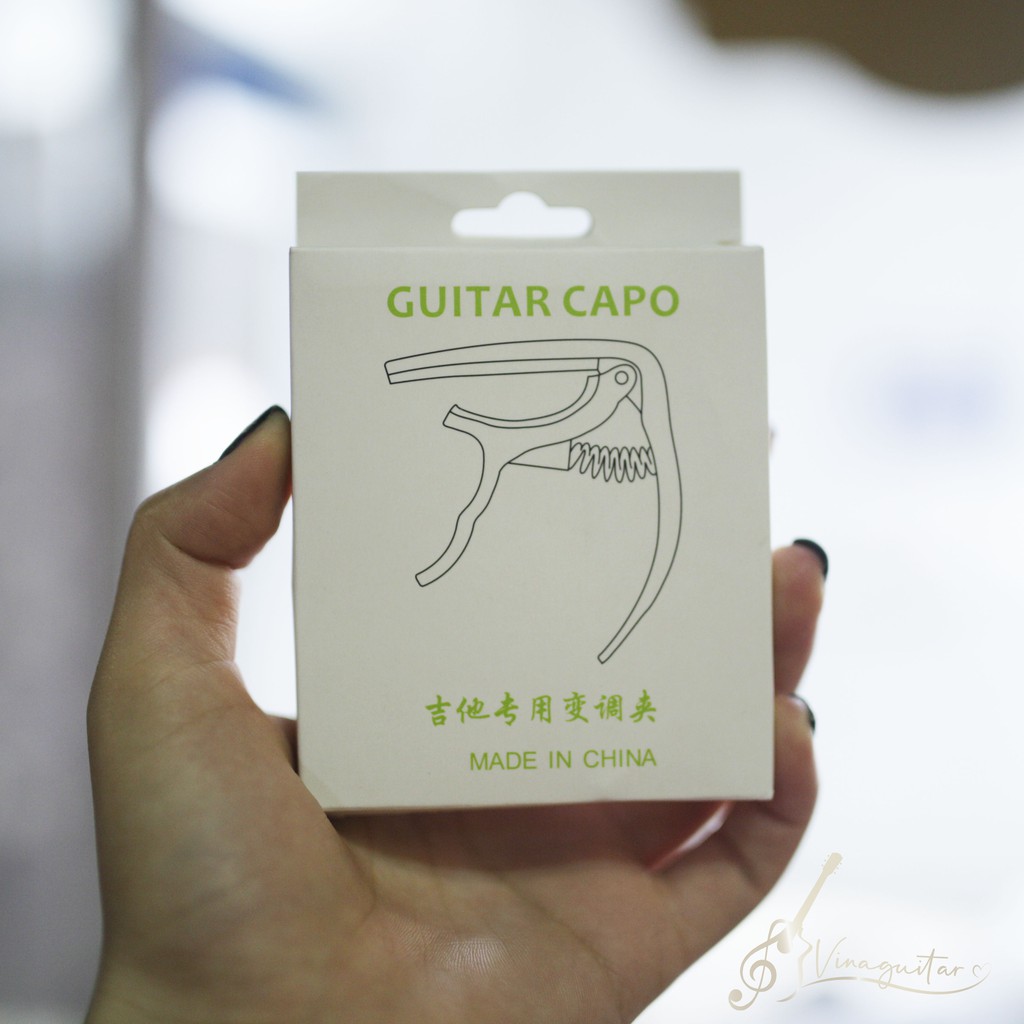 Capo guitar acoustic lò xo có chốt nhổ dây