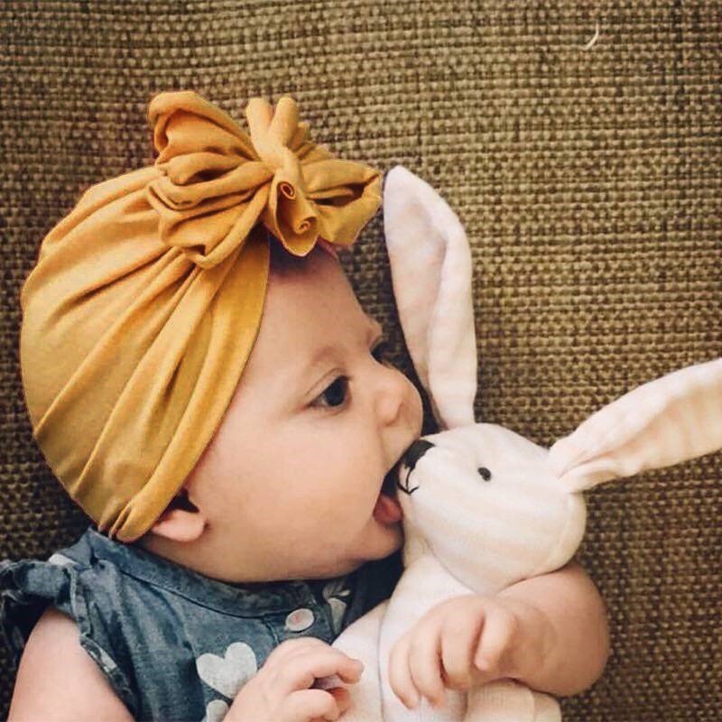 Nón trùm đầu có chi tiết nơ dễ thương cho bé