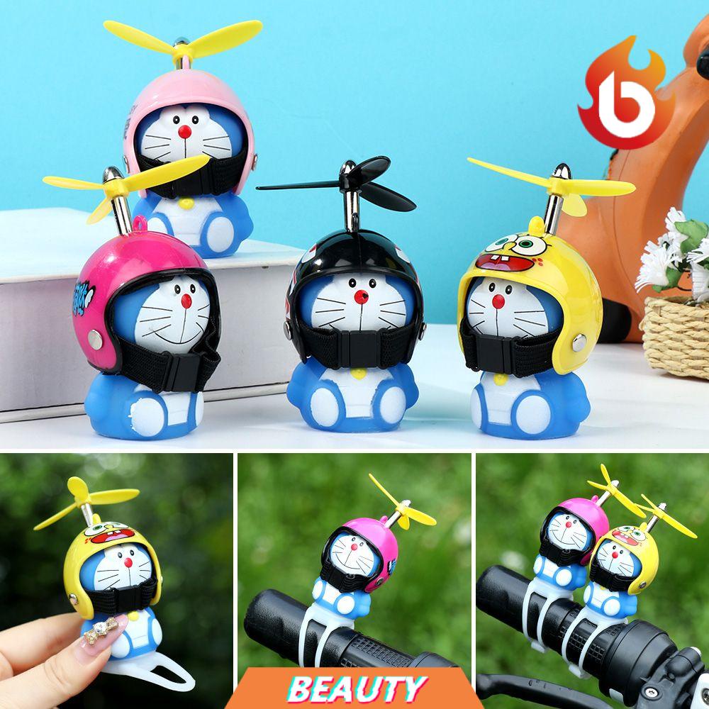 Búp bê doraemon đội mũ bảo hiểm có đèn cho xe hơi xe máy