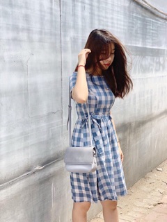 Đầm caro nơ eo .