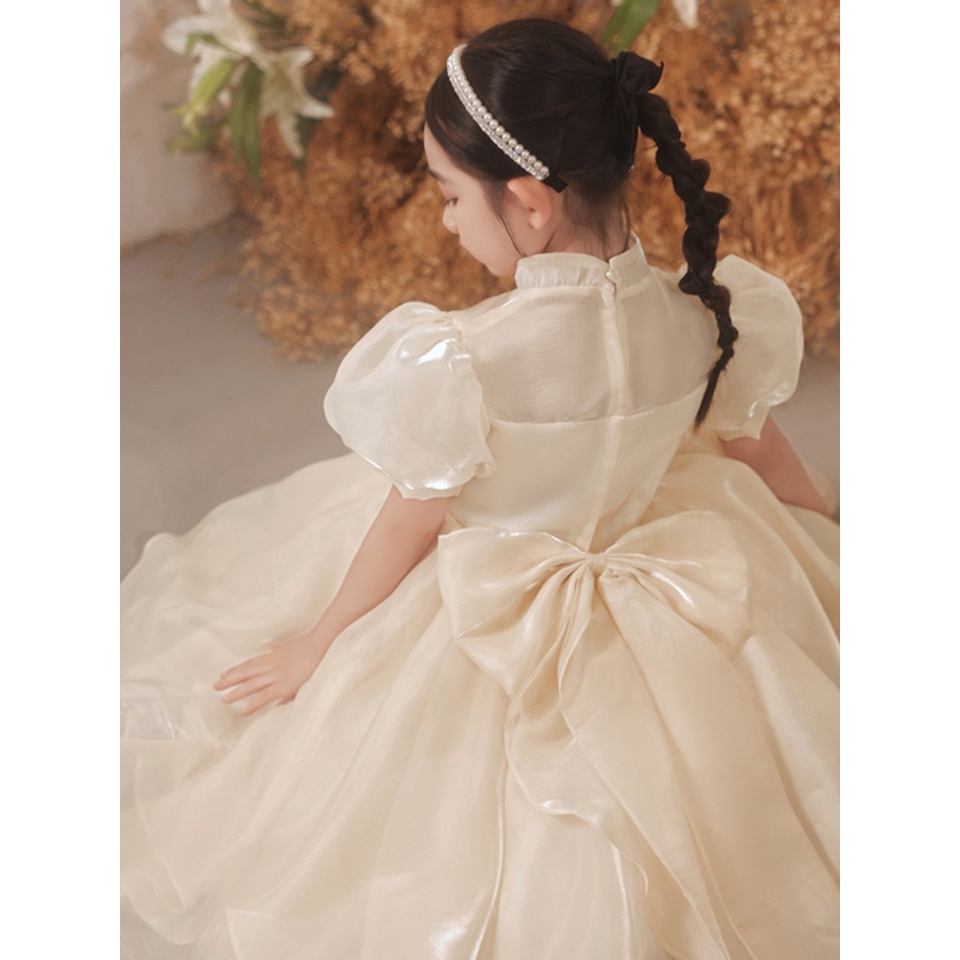 Đầm Công Chúa Cho Bé Poopi Dáng Xòe Màu Be Sữa Đính Nơ Lưng, Váy Cho Bé Gái Dự Tiệc Xinh Đẹp