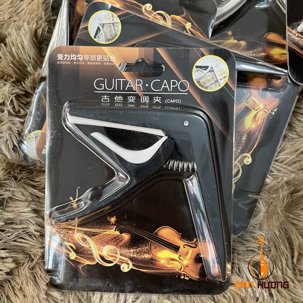 Capo classic ngắn  kiêm tháo chốt dây đàn