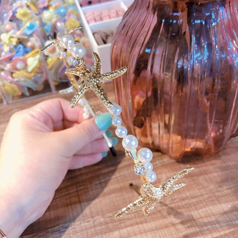 Băng đô cài tóc màu vàng ánh kim đính sao biển ngọc trai nhân tạo thời trang dành cho nữ