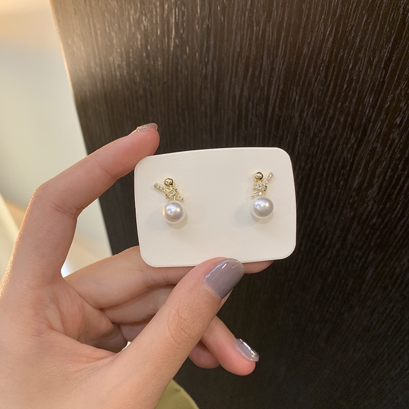 Bông tai hình nơ đính ngọc trai nhân tạo xinh xắn