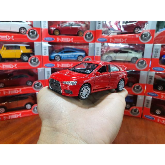 HỘP XE MÔ HÌNH Mitsubishi Lancer Evolution WELLY 1:36 (Đỏ)