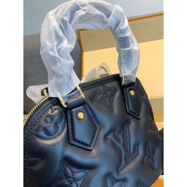 Túi lv hến cầm tay