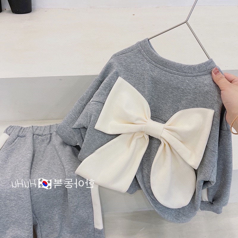 Set quần bo ống + áo nơ lưng điệu đà cho bé gái