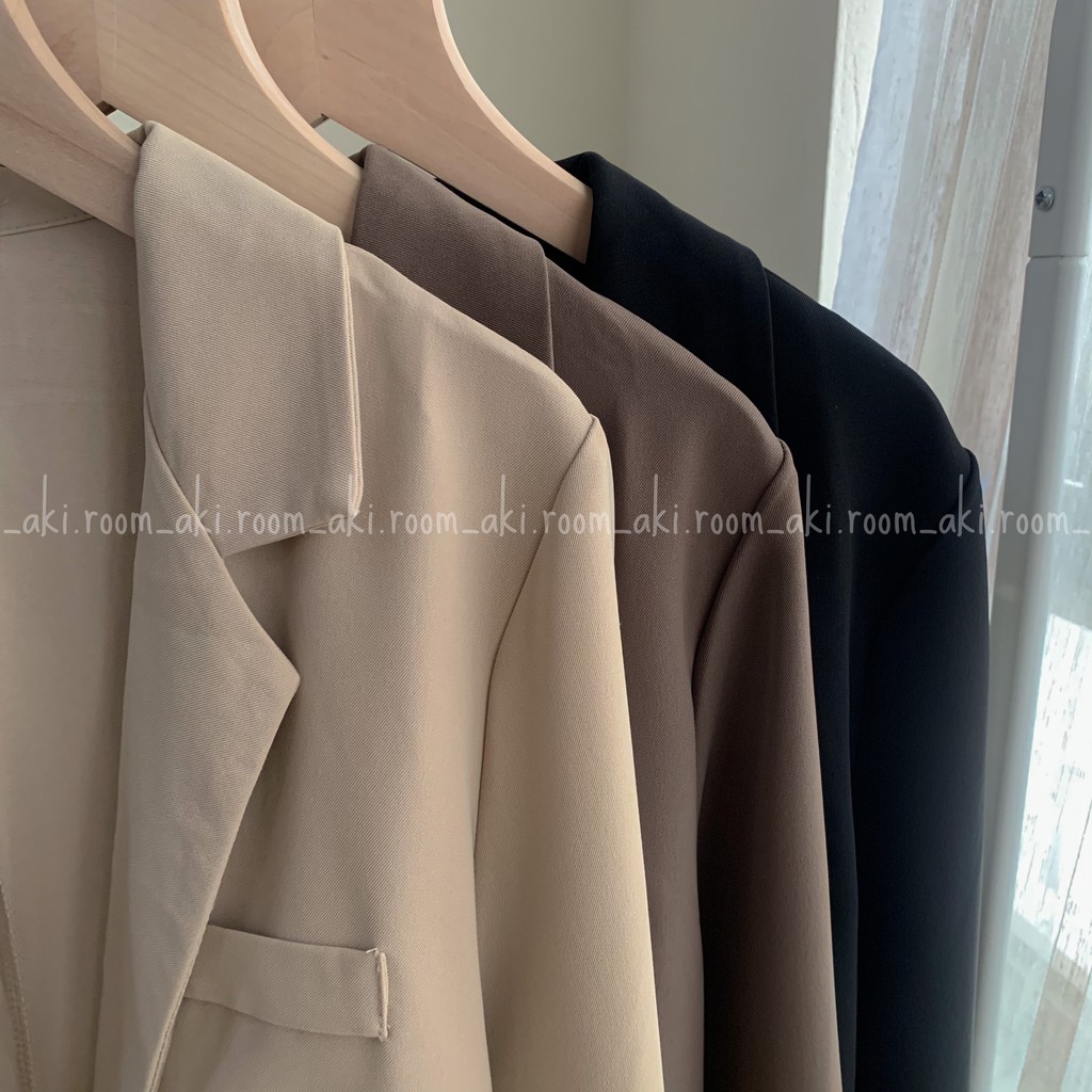 Áo blazer một lớp bốn khuy túi giả ngực trái