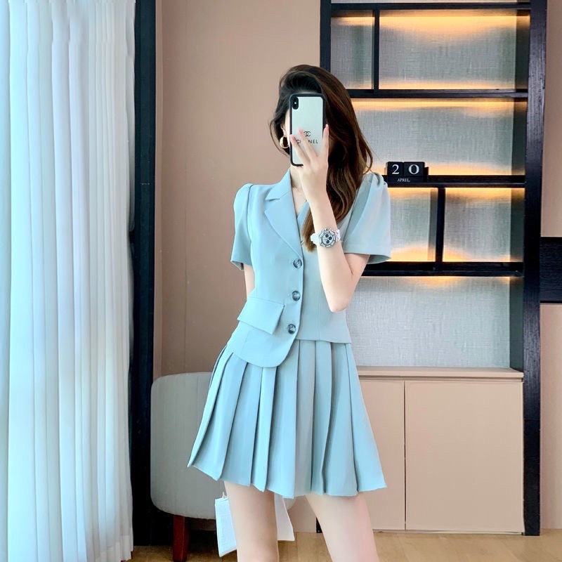 SET CHÂN VÁY XOÈ+ÁO VEST CỘC TAY