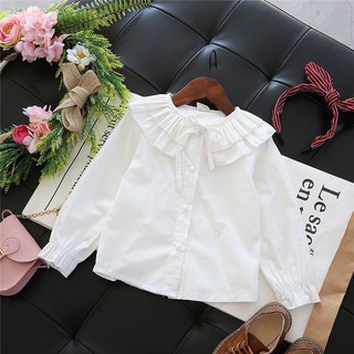 Áo sơ mi trắng buộc nơ cho bé gái