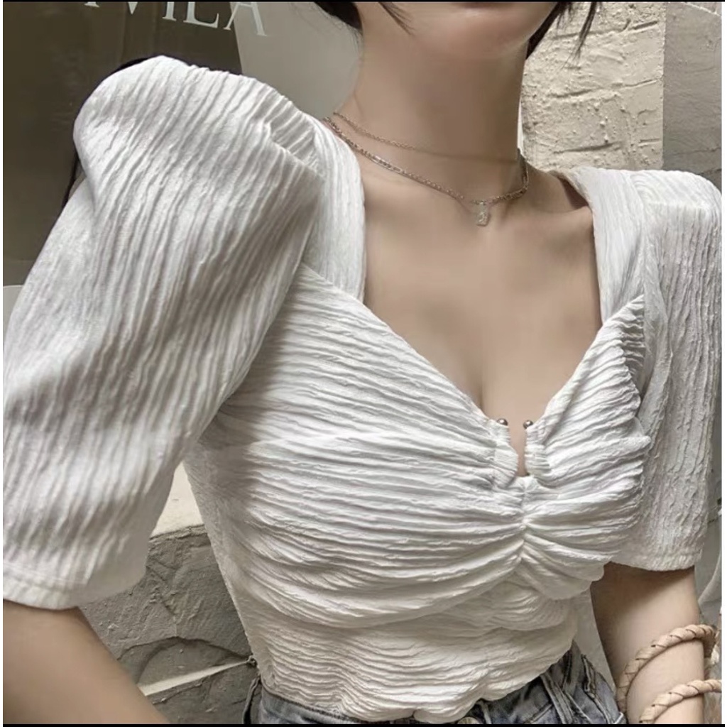 🍀🍀Áo thun chất liệu vân gỗ,thiết kế phần xoắn ở ngực lại xẻ xinh xinh🍀🍀