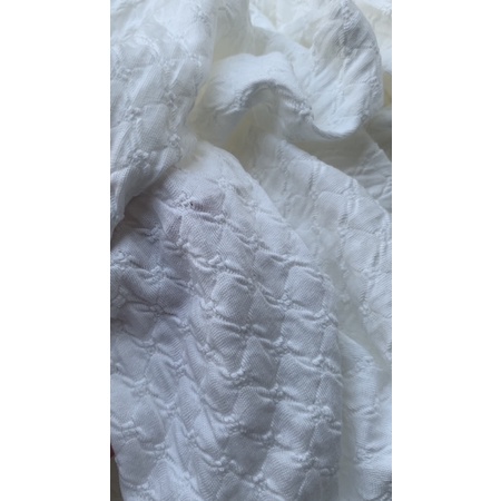 Vải thun thêu trắng