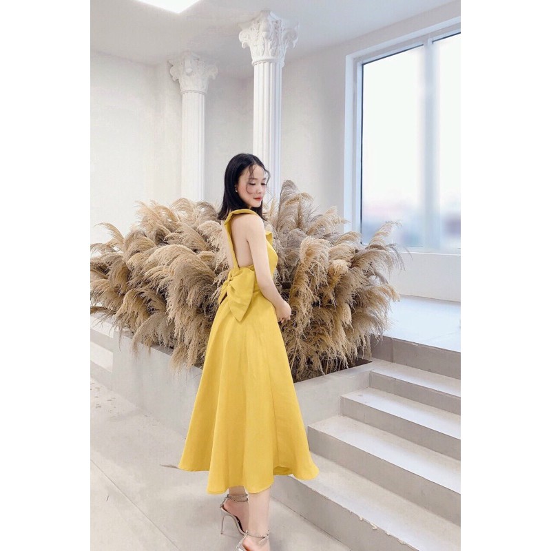 đầm xoè lệch vai nơ sau to