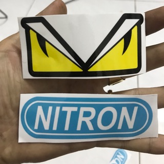 2 miếng tem nitron bự và tem con mắt fendi  dán  xe