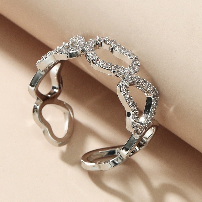 Elegant open-cut heart-shaped ring with zircon stones for women