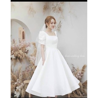 Đầm dự tiệc trắng xòe nơ lưng sang trọng