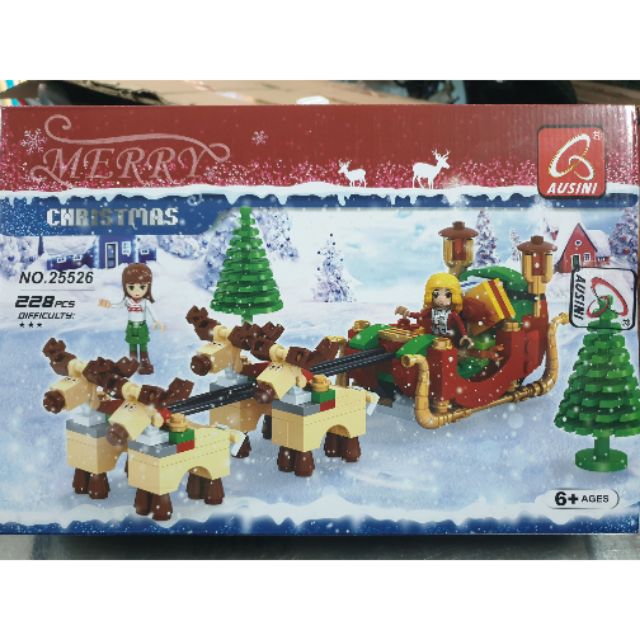 Lego ausini 25526 ông già noel và chiếc xe kéo tuần lộc chở quà tặng giáng sinh cho trẻ em đi trong tuyết rừng thông