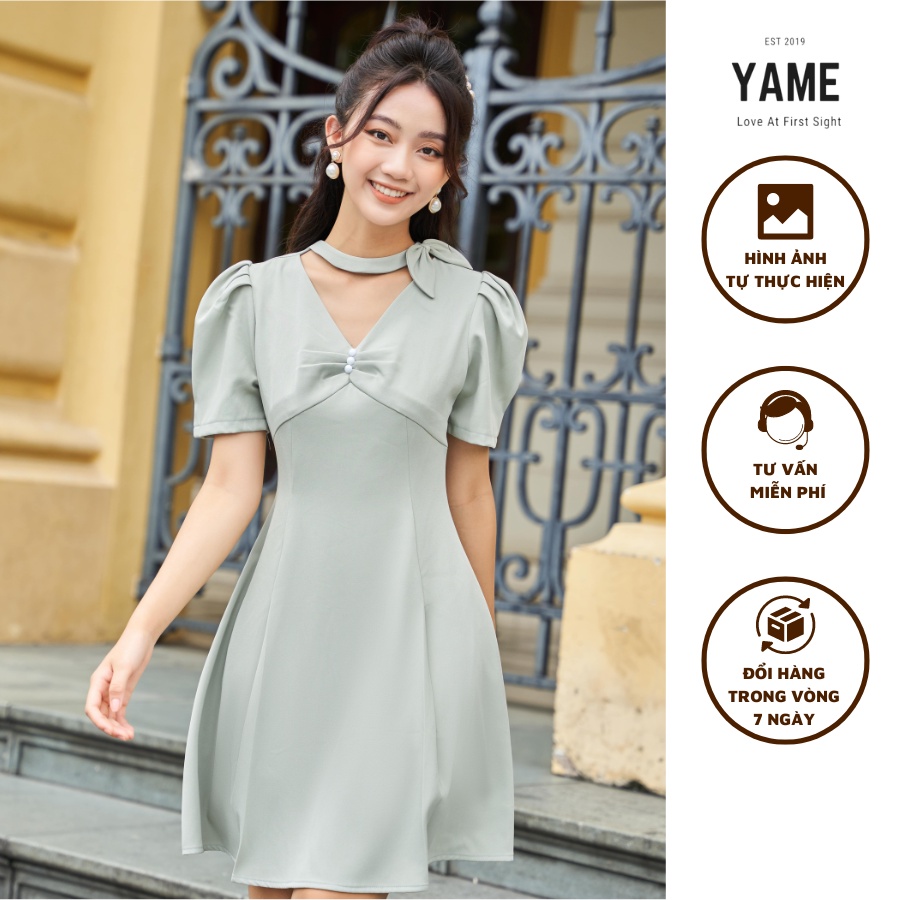 Váy chữ A công sở tay bồng cổ V màu xanh cổ nơ đính lệch YAME