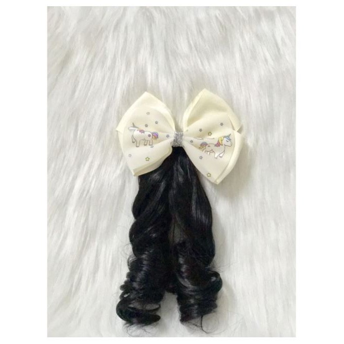 Kẹp nơ tóc xoăn cho bé