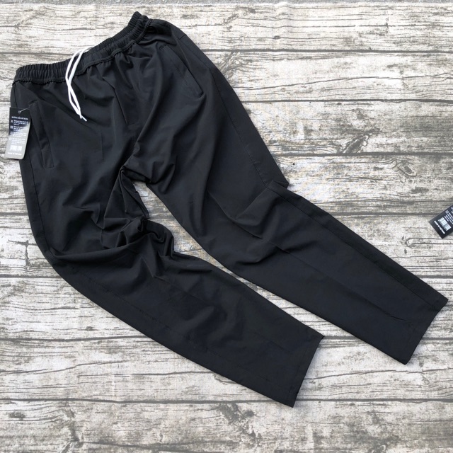 Quần gió nam ống buông