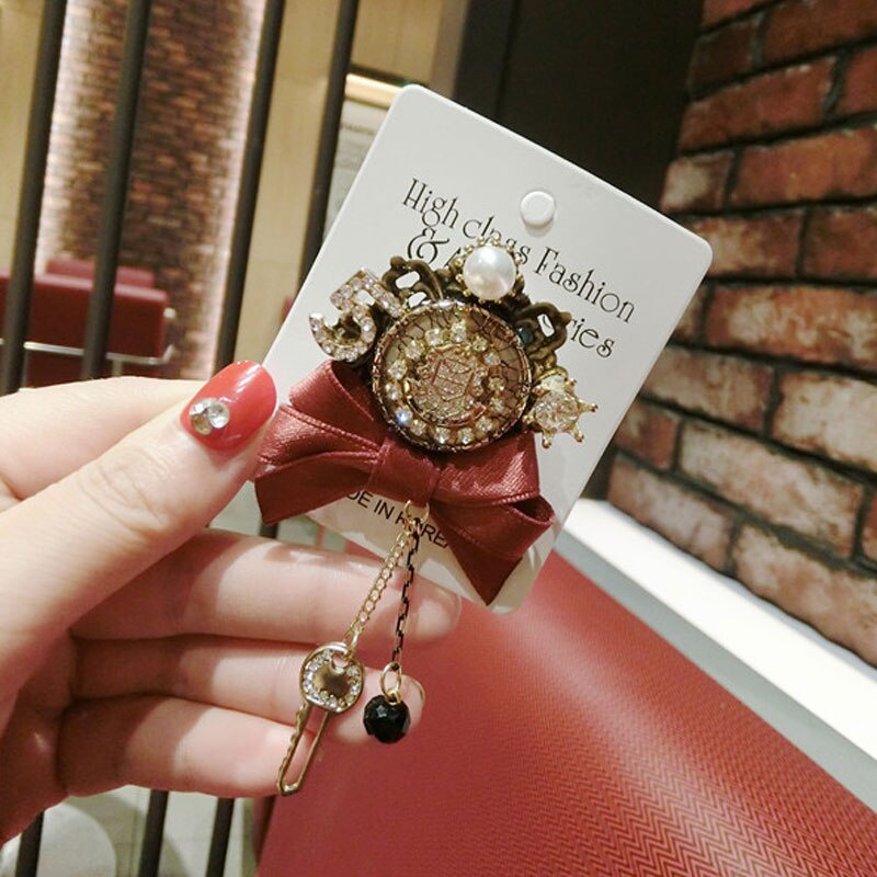 Ghim cài áo hình nơ đính đá thiết kế sang trọng cho nữ