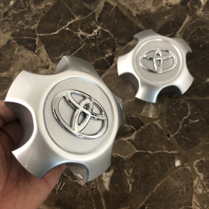 Sản Phẩm Logo chụp mâm, ốp lazang bánh xe ô tô Toyota RAV4 2009-2013 TY-030 .