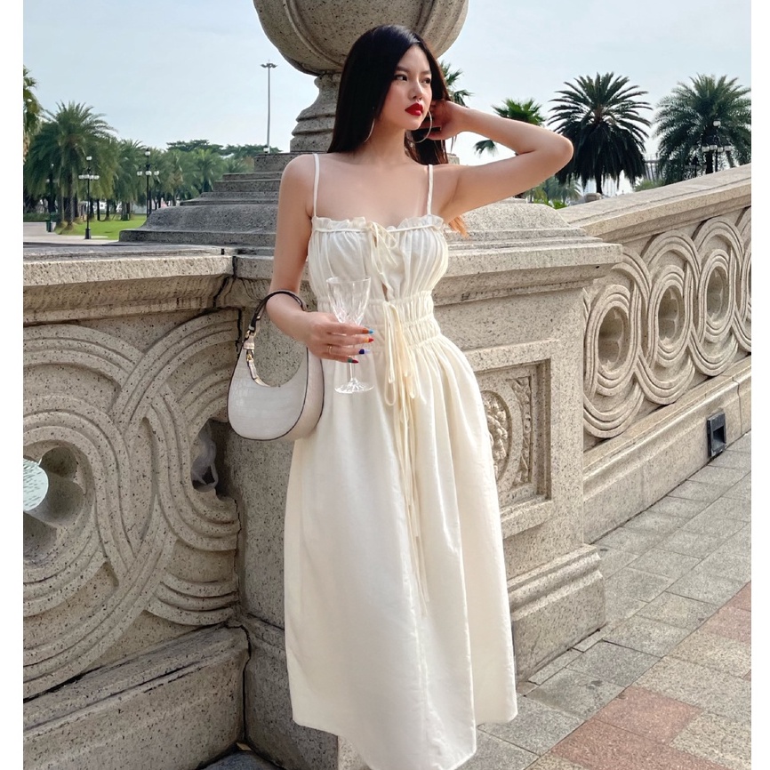 TUBYCATU | Đầm kem hai dây rút 3 đường cột nơ