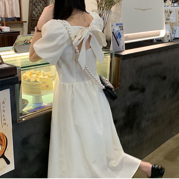 Đầm hở lưng tay phồng pháp mới dài trung bình tính khí Váy trắng cổ vuông eo cao nữ