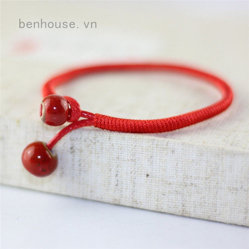 Vòng chỉ đỏ đeo tay dây bện đồng tiền vàng mang lại may mắn