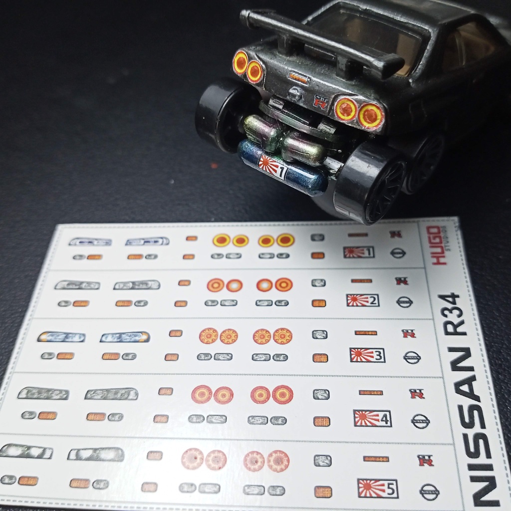 Hugo Studios Decal trượt nước đèn xe Nissan R34 tỉ lệ 1/64 chưa phủ clear