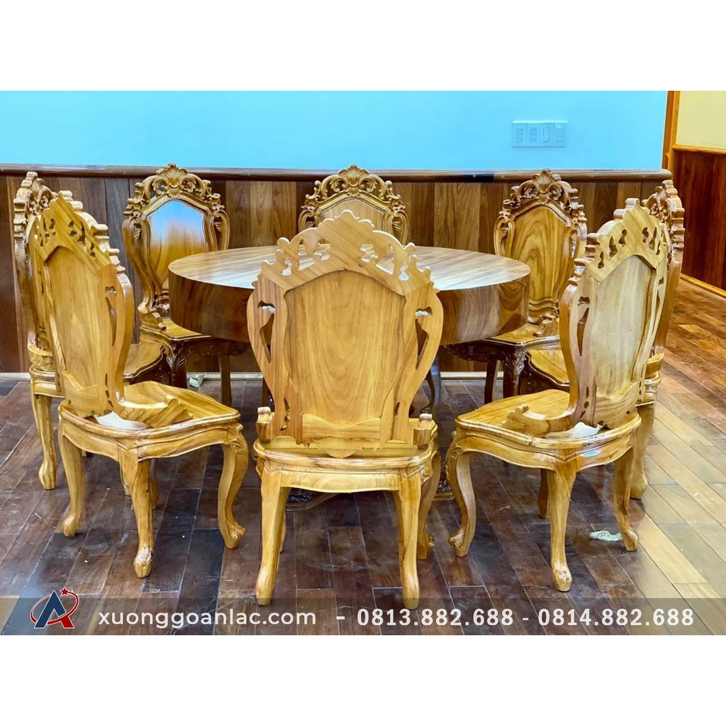 Bộ bàn ăn tròn nguyên khối 1m5x16cm gỗ gõ đỏ 8 ghế hoa lá tây