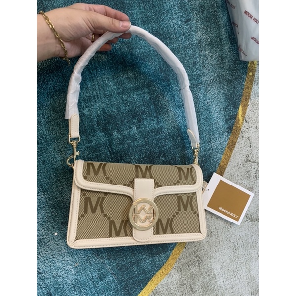 Túi 𝐌𝐢𝐨𝐜𝐫𝐚 𝐤𝐨𝐥𝐲 nền logo khoá vàng