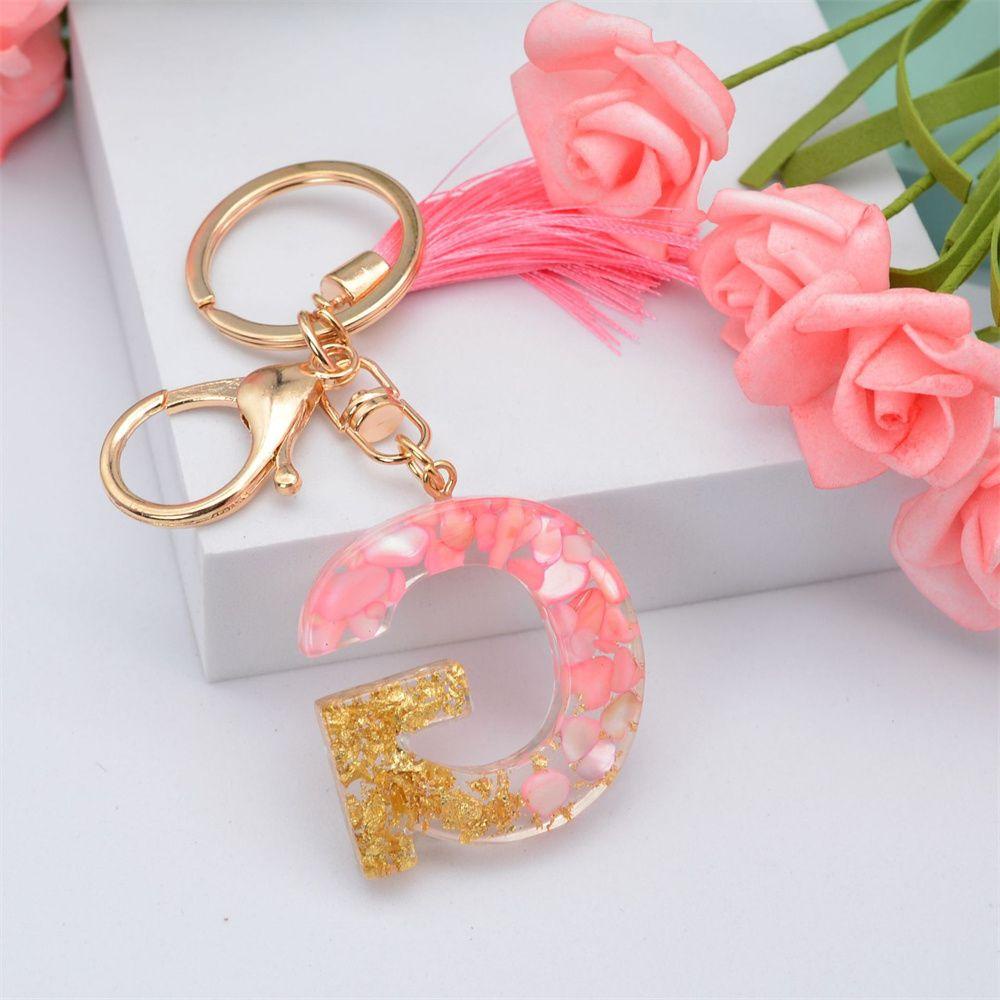 Móc Khóa Hình 26 Chữ Cái Tua Rua Dễ Thương